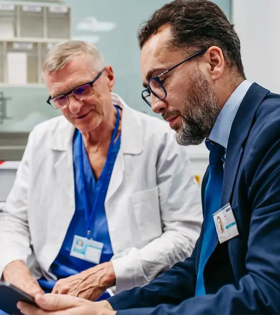Doctor and healthcare professional reviewing information together.