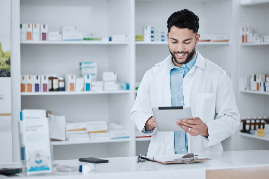 Man, clipboard and pharmacist with checklist for stock, drugs and health with quality assurance. Pill dispensary at hospital, pharmacy and check inventory with healthcare, wellness and medicine data