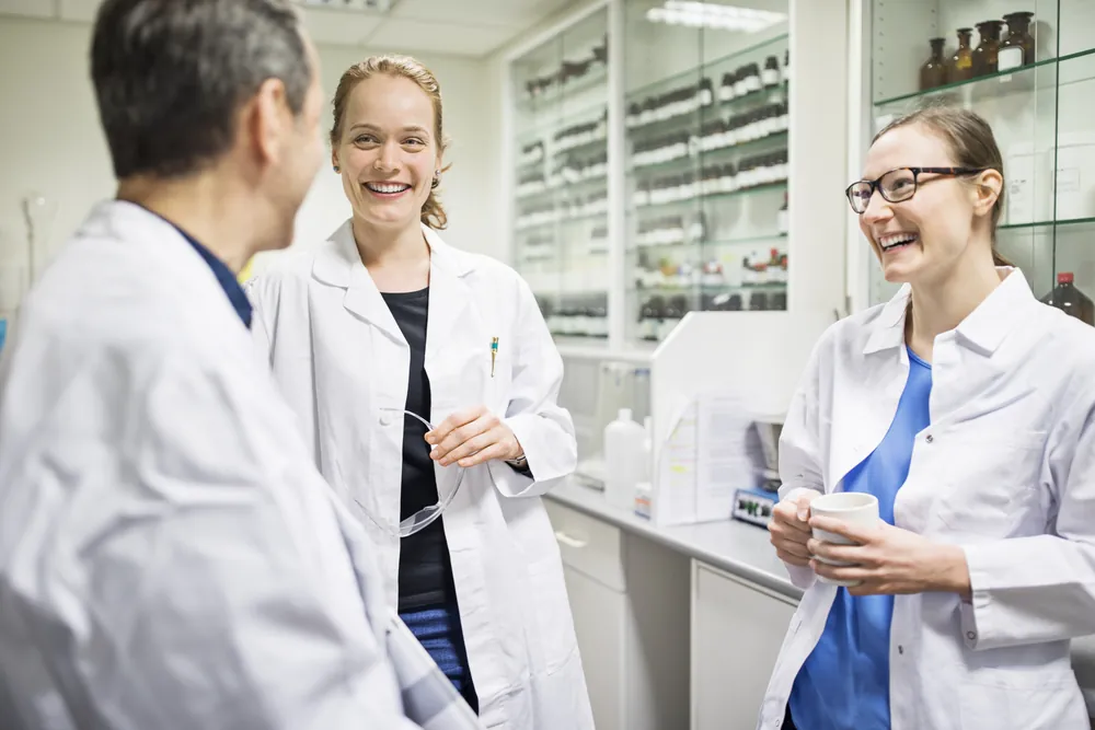 Pharmacists sharing a laugh in the pharmacy